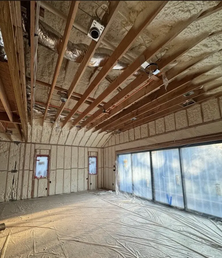 Interior walls and ceiling insulated with spray foam during new construction in Layhill